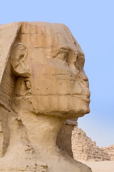 Focus on the stone face of the Egyptian Sphinx in Giza