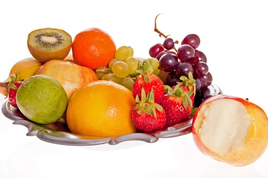 Composition of fresh fruit on the decorative metal tray.