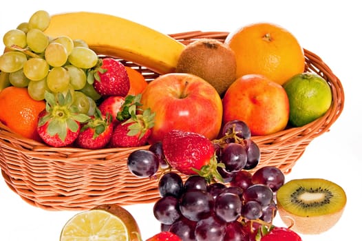 Various fresh ripe fruits placed in a wicker basket