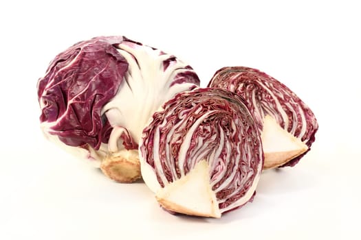 Two radicchio against white background