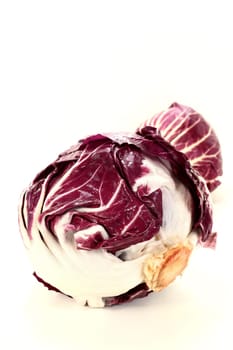 Two radicchio against white background