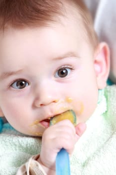 Baby boy eating vegetable mash