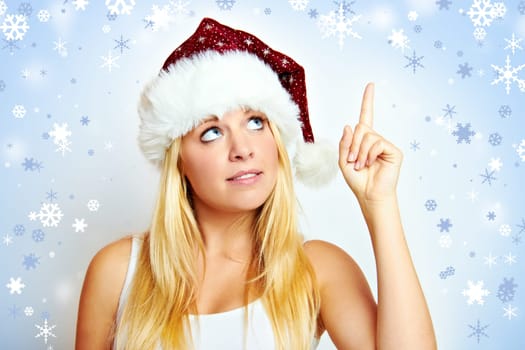 Happy young beautiful woman at christmas with christmas background