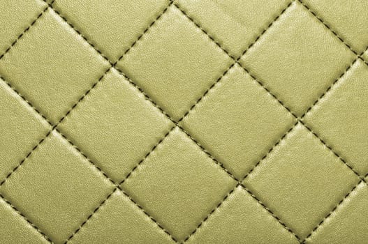 Vintage background with golden leather, texture of leather.