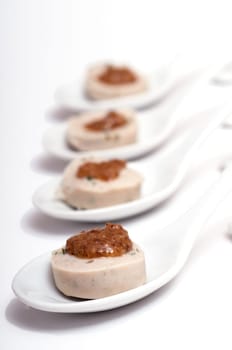 Four spoons of white sausage and sweet mustard
