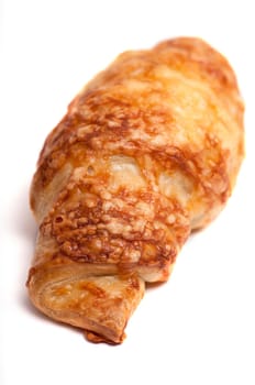 Ham croissant with cheese au gratin on white background