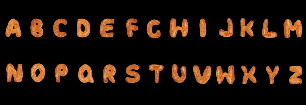 Letters of the British alphabet made of gingerbread over black background