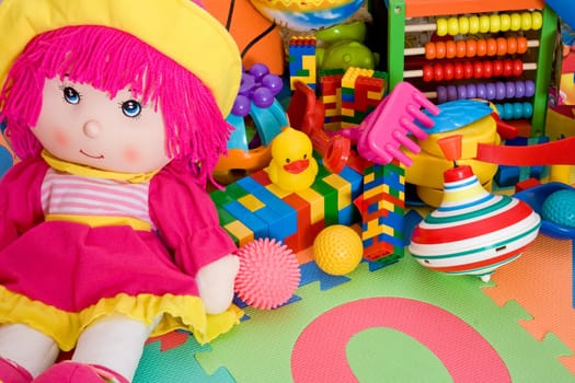 huge pile of various colorful children&#039 s toys