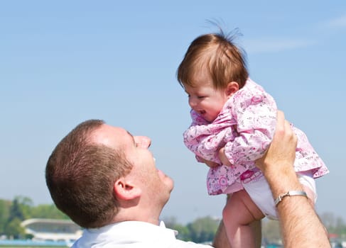father playing with his baby