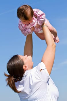 mother playing with her baby
