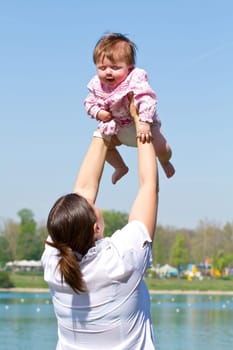 mother playing with her baby