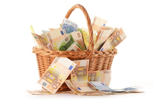 Composition with Euro banknotes in wicker basket. European Union currency