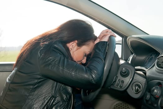 Young woman sleeping in the car
