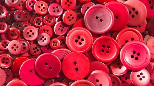 Red buttons, small and large as a background texture.