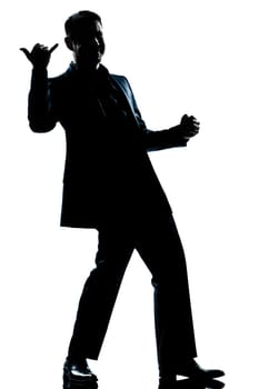 one caucasian man happy saluting shaka sign full length silhouette in studio isolated white background