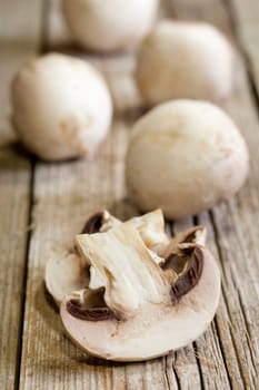 Fresh mushrooms on a brown wooden board
