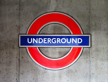 London underground sign on a concrete wall