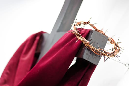 Crown of thorns hung around the Easter cross