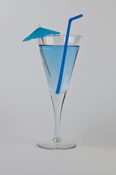 Single Blue Martini with matching straw and umbrella