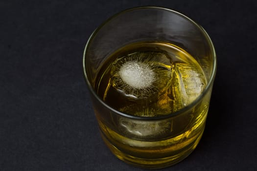 A glass of scotch whisky on the rocks
