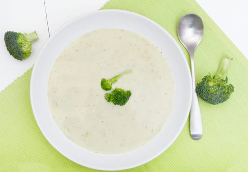White Bowl of Cream or  Broccoli Soup on Green