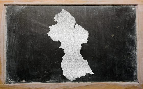 drawing of guyana on blackboard, drawn by chalk