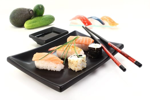various sushi with parsley and chives