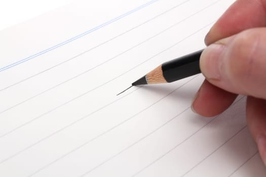 Writing hand with a blue pencil