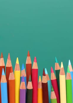 Group of pencils, blackboard behind