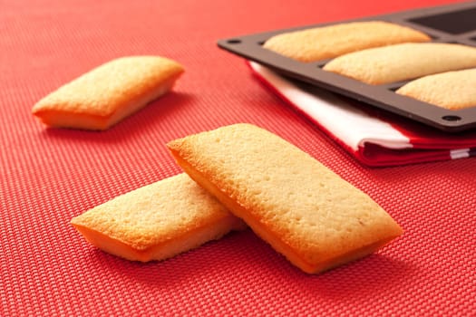 French biscuits called Financiers, with almond powder, smooth inside and crispy on the edges