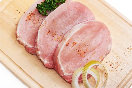 Fresh slices of pork isolated on white