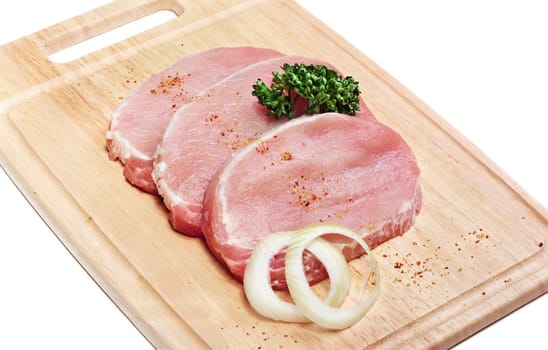 Fresh slices of pork isolated on white