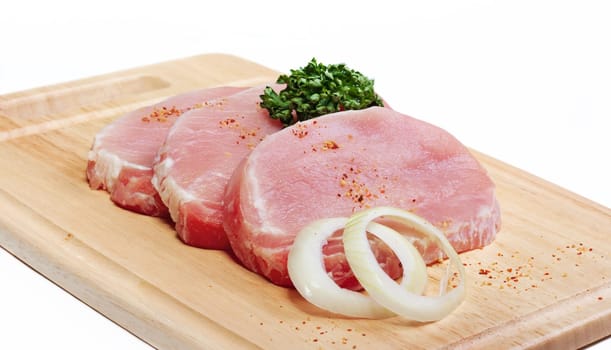 Fresh slices of pork isolated on white