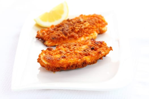 Fried chicken schnitzel with lemon