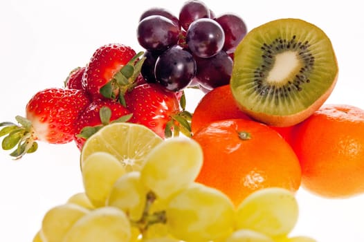Close up of different fruits isolated over white