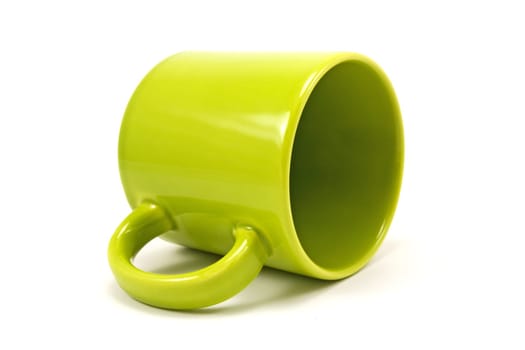 green teacup isolated on a white background
