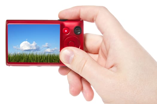 hand hold  photo camera and taking landscape photography