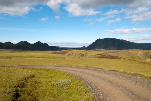 Landscape with dirt road to Vik in Iceland