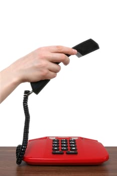 Telephone receiver in a female hand. isolated on white