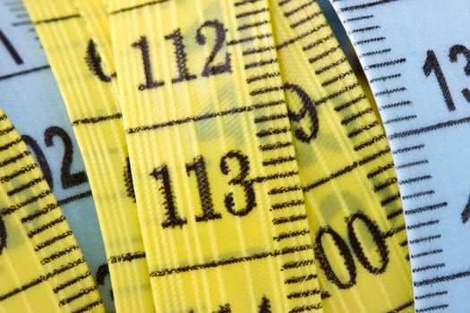 close-up view of yellow and blue measuring tape