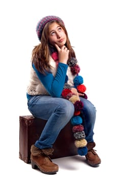Beautiful young girl posing with case isolated in white