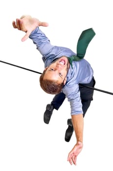 Businessman jumping over an Olympic high-jump bar