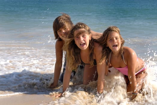 Kids having fun in the water in summer time