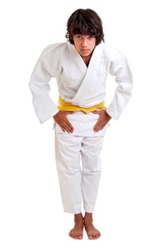 Young fighter posing against a white background