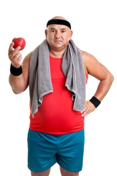 Large fitness man with an apple isolated in white