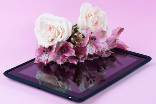 a composition and black tablet with flowers