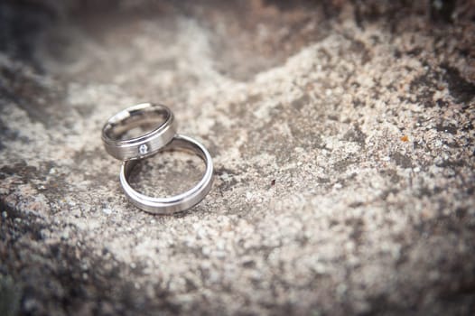 Pair of wedding rings on a stone