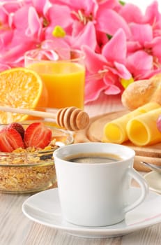 Breakfast with coffee, rolls, egg, orange juice, muesli and cheese