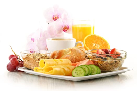 Breakfast with coffee, rolls, egg, orange juice, muesli and cheese