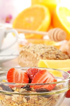 Breakfast with coffee, rolls, egg, orange juice, muesli and cheese